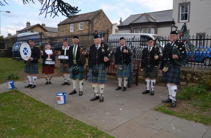 Pipe band busks for instrument funds