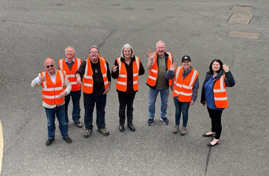 Volunteers scale the heights to make town look its best