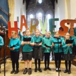 Young worship team leads harvest festival