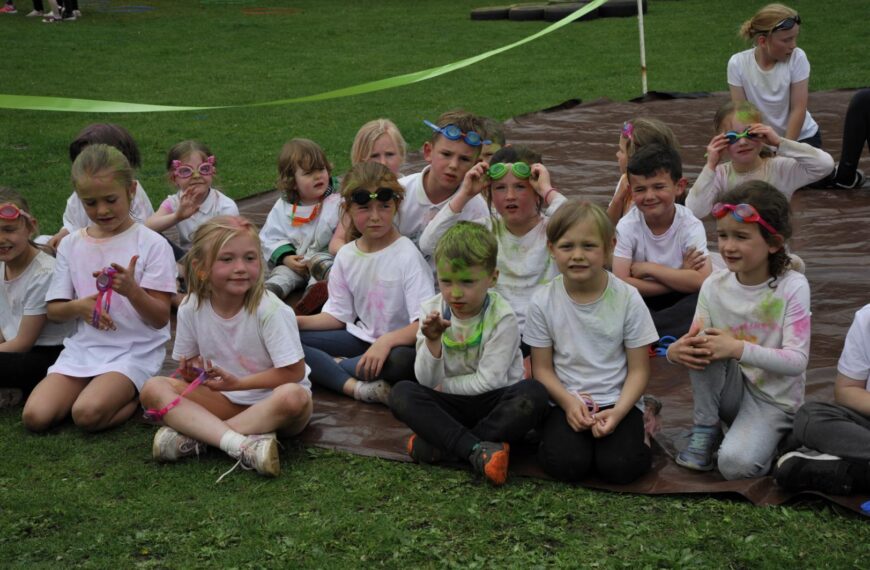 Pupils run colourful gauntlet to celebrate end of term