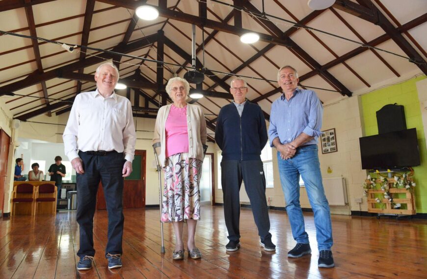 Modern ceiling for old hall adds warmth and cuts costs