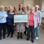 Charity cheques from quilters show
