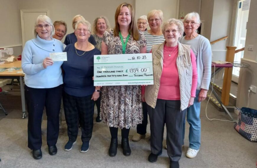 Charity cheques from quilters show