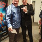 John raises a smile with comedy legend