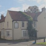 Bid for illuminated signs for new village…