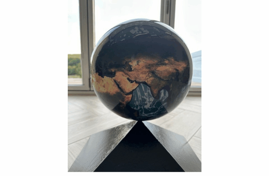 School on top of world after symbol reinstated on roof